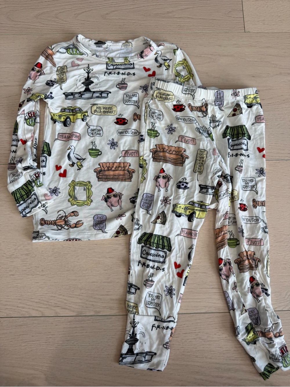 Posh Peanut White Kids Pajama Set with Multicolor Friends Print | 2T